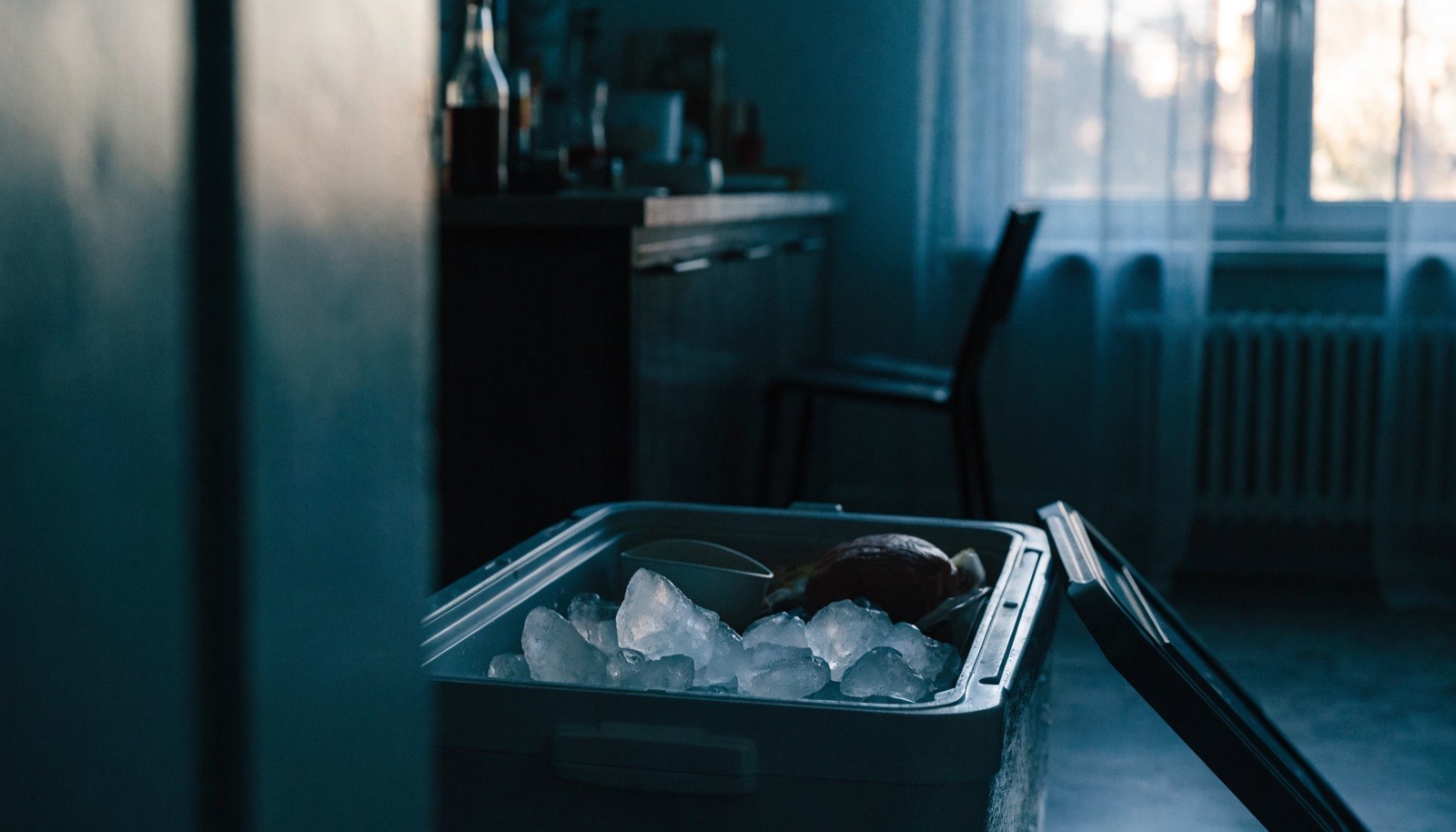 Cooler packed with ice keeping food cold during a power outage